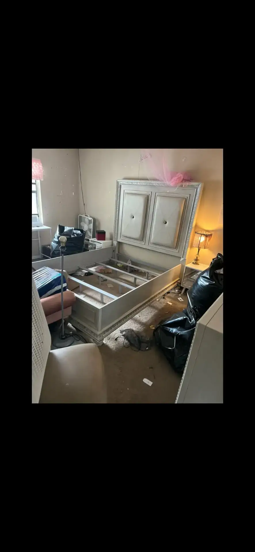 Furnished apartment bedroom before a tenant turnover trash-out