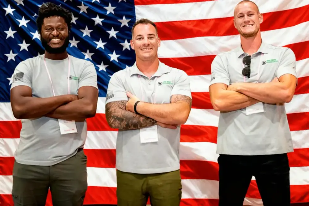 The Junk Generals crew standing together in front of an American flag